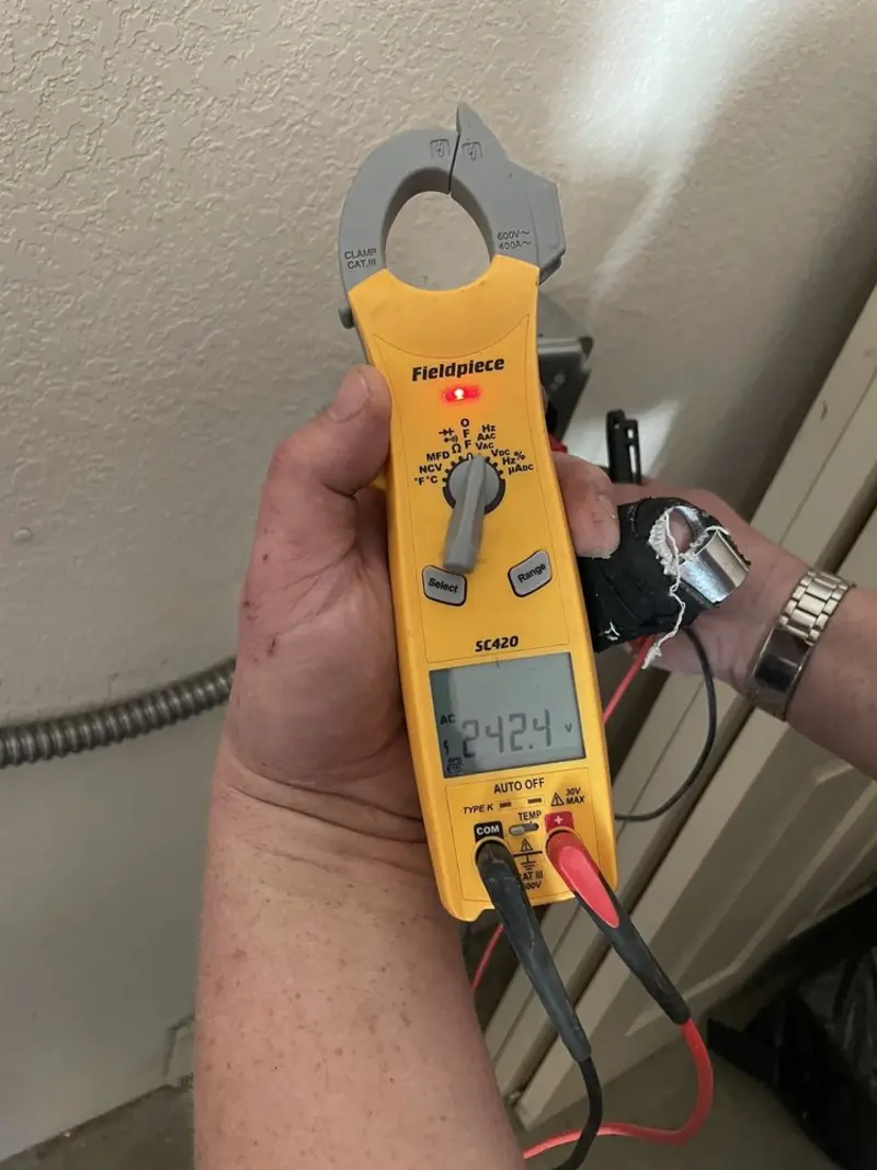 Voltage testing with clamp meter during Hot Tub / Pool Electrical Wiring in Berne
